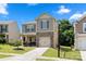 Charming two-story home with stone accents, attached garage, and well-manicured lawn at 4732 Gibbons Link Rd, Charlotte, NC 28269
