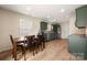 Open-concept kitchen and dining area, filled with natural light and featuring stainless steel appliances at 4732 Gibbons Link Rd, Charlotte, NC 28269