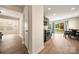 Bright, modern kitchen with stainless steel appliances, wood floor, dining table and sliding door to backyard at 4732 Gibbons Link Rd, Charlotte, NC 28269