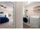 Well-equipped laundry room with modern washer and dryer next to bedroom at 4732 Gibbons Link Rd, Charlotte, NC 28269
