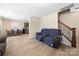 Open-concept living space featuring modern flooring, seamless flow into the dining and kitchen areas at 4732 Gibbons Link Rd, Charlotte, NC 28269