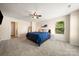 Bright main bedroom features a comfortable bed, modern decor, and a large window view at 4732 Gibbons Link Rd, Charlotte, NC 28269