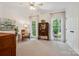 Bright bedroom with hardwood floors, tall windows, and plenty of natural light at 5008 Saddle Horn Trl, Weddington, NC 28104
