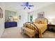 Cozy bedroom with colorful accent wall, a blue dresser, and a bench at 5008 Saddle Horn Trl, Weddington, NC 28104