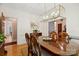 Cozy dining area featuring hardwood floors, modern lighting, and an open transition to other rooms at 5008 Saddle Horn Trl, Weddington, NC 28104