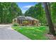 Charming brick home with a well-manicured lawn, mature trees, and inviting curb appeal, showing true pride of ownership at 5008 Saddle Horn Trl, Weddington, NC 28104