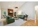 Bright living room with a brick fireplace, comfortable seating, and a ceiling fan at 5008 Saddle Horn Trl, Weddington, NC 28104