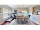 Sunlit dining room featuring hardwood floors and a stylish light fixture at 6313 Woodland Commons Dr, Charlotte, NC 28269
