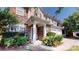 Inviting front entrance with a covered porch and lush landscaping at 6313 Woodland Commons Dr, Charlotte, NC 28269