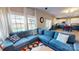 Bright living room with a large sectional and view of the kitchen at 6313 Woodland Commons Dr, Charlotte, NC 28269