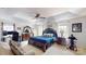 Spacious main bedroom with trey ceilings, a ceiling fan, and a cozy seating area with lots of natural light at 6313 Woodland Commons Dr, Charlotte, NC 28269