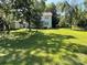Wide shot of expansive backyard with shed and mature trees at 6708 Nutcracker Pl, Charlotte, NC 28212