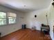Bedroom with hardwood floors and a window letting in natural light at 6708 Nutcracker Pl, Charlotte, NC 28212