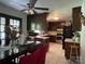 Spacious eat-in kitchen with dark cabinetry, stainless steel appliances, and tile flooring at 6708 Nutcracker Pl, Charlotte, NC 28212