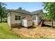 Backyard view with a storage shed and deck with a staircase at 7516 O'Hara St, Huntersville, NC 28078