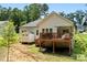 The backyard has a deck with stairs, a storage shed, and nice lawn at 7516 O'Hara St, Huntersville, NC 28078