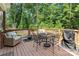 Outdoor deck with seating area, grill, and fire pit, perfect for entertaining and relaxation at 7516 O'Hara St, Huntersville, NC 28078