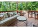 Inviting outdoor deck featuring comfortable seating and tranquil views of surrounding lush greenery at 7516 O'Hara St, Huntersville, NC 28078