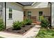Charming home with a well-manicured front lawn and cozy porch at 7516 O'Hara St, Huntersville, NC 28078