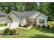 Charming single Gathering home with a well-manicured lawn, tidy landscaping, and welcoming front porch at 7516 O'Hara St, Huntersville, NC 28078