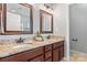 Bathroom featuring a double vanity with granite countertops and bronze fixtures at 7612 Turley Ridge Ln, Charlotte, NC 28273