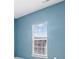 Bright bedroom featuring blue walls, a window with blinds, and ample natural light at 7612 Turley Ridge Ln, Charlotte, NC 28273