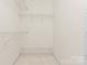 Walk-in closet with ample shelving space for optimal organization at 7612 Turley Ridge Ln, Charlotte, NC 28273