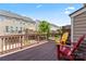 Relax on this charming deck with wood railings and colored Adirondack chairs, perfect for enjoying the outdoors at 7612 Turley Ridge Ln, Charlotte, NC 28273