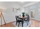 An eat-in dining area is bright with natural light, featuring a modern light fixture at 7612 Turley Ridge Ln, Charlotte, NC 28273