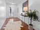 Stylish hallway with hardwood floors and console table and potted plant at 7612 Turley Ridge Ln, Charlotte, NC 28273