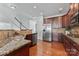 Modern kitchen with stainless steel appliances, granite countertops, and hardwood floors at 7612 Turley Ridge Ln, Charlotte, NC 28273