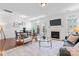 A bright living room and dining area features a fireplace and direct access to outdoor living at 7612 Turley Ridge Ln, Charlotte, NC 28273