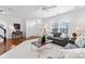 Bright living room with gray sofa, modern decor, and hardwood floors at 7612 Turley Ridge Ln, Charlotte, NC 28273