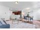 An open-concept living room and dining area features hardwood floors and stylish decor at 7612 Turley Ridge Ln, Charlotte, NC 28273