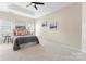 A spacious main bedroom offers a tray ceiling, ensuite bathroom, and natural light at 7612 Turley Ridge Ln, Charlotte, NC 28273