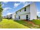 Spacious backyard featuring a large, well-maintained lawn and a patio for outdoor enjoyment at 8330 Kneller St, Charlotte, NC 28215