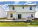 Backyard featuring a covered grill on a patio with green grass, a sunny day, and privacy fence at 8330 Kneller St, Charlotte, NC 28215