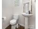 White half bathroom featuring modern fixtures, a pedestal sink, and starfish decorations at 8330 Kneller St, Charlotte, NC 28215