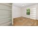 Bedroom featuring carpet and built-in shelving with a window at 8330 Kneller St, Charlotte, NC 28215