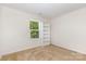 Bedroom featuring carpet and built-in shelving with a window at 8330 Kneller St, Charlotte, NC 28215