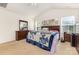 Spacious bedroom with vaulted ceiling, plush carpet, and two windows for natural light at 8330 Kneller St, Charlotte, NC 28215