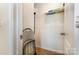 A small closet with white walls, one wire shelf, and an open white door, useful for storage at 8330 Kneller St, Charlotte, NC 28215