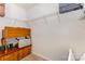 Walk-in closet with white wire shelving and built-in wooden drawers and cushioned bench at 8330 Kneller St, Charlotte, NC 28215