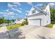 Well-maintained two-story home featuring white siding, a driveway, and a well-manicured lawn at 8330 Kneller St, Charlotte, NC 28215