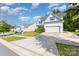 Attractive two-story home boasting white siding, a spacious driveway, and a well-maintained lawn at 8330 Kneller St, Charlotte, NC 28215