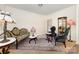 Formal living room with vintage furniture and an oriental rug on top of beige carpet at 8330 Kneller St, Charlotte, NC 28215
