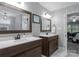 Elegant bathroom with double vanities, white countertops, and modern fixtures at 9141 Covey Hollow Ct, Charlotte, NC 28210
