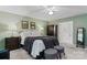 Serene bedroom featuring a cozy bed, bedside tables, and soft lighting at 9141 Covey Hollow Ct, Charlotte, NC 28210