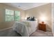 Inviting bedroom with soft natural light and serene ambiance with matching night stands at 9141 Covey Hollow Ct, Charlotte, NC 28210