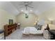 Bright and airy bedroom with a vaulted ceiling and cozy decor, including neutral decor at 9141 Covey Hollow Ct, Charlotte, NC 28210